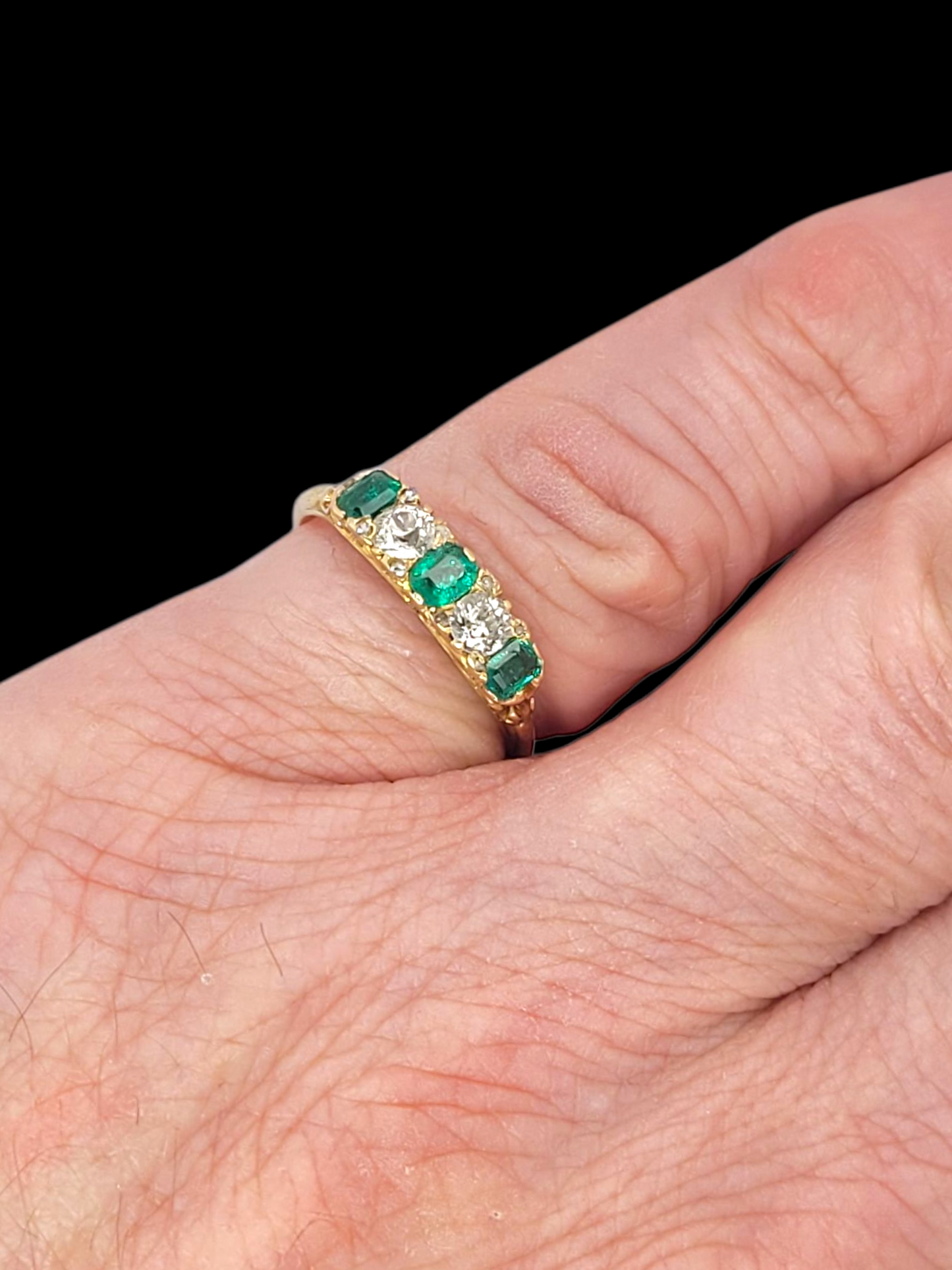 Antique emerald and diamond carved half hoop ring
SKU: 8358