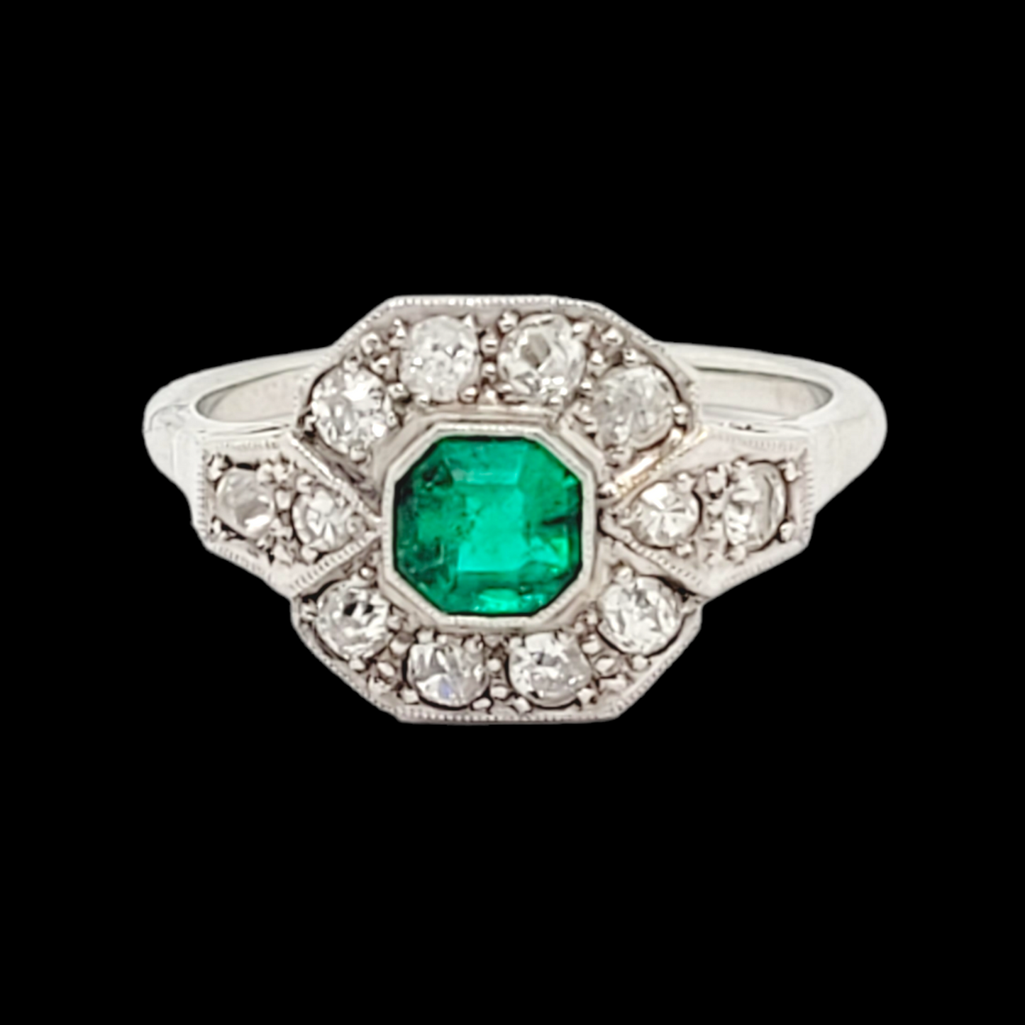 Art deco emerald and diamond engagement ring