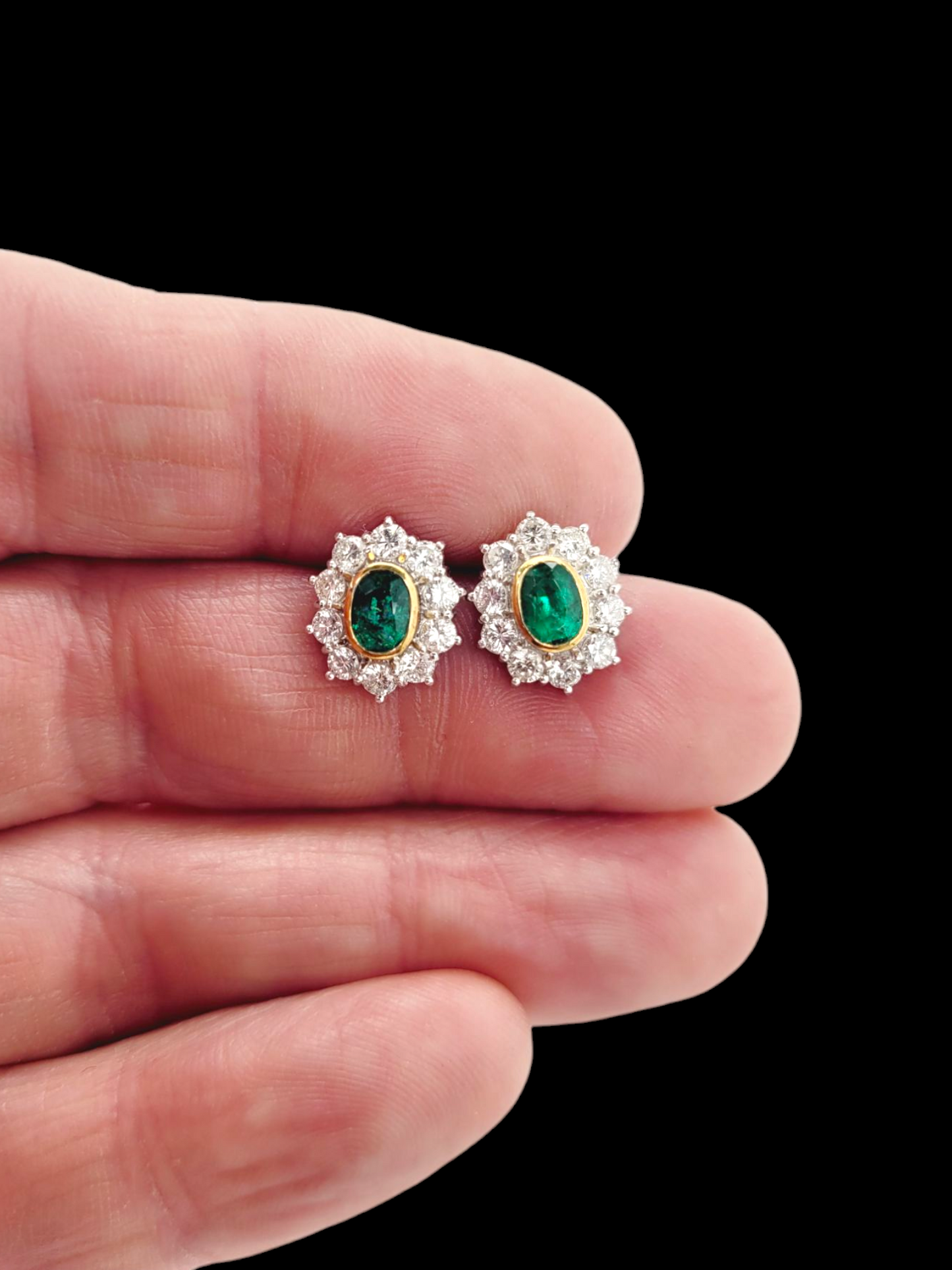 Pair of emerald and diamond oval cluster earrings
SKU: 7956